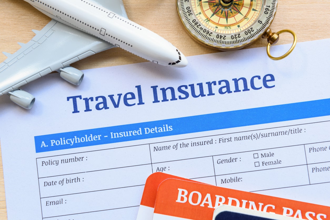 A form for essential travel insurance for the airport and beyond on a table