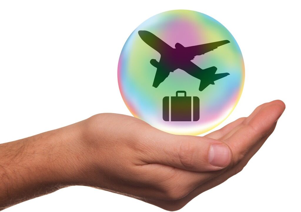 Travel insurance plane and suitcase protected in a bubble